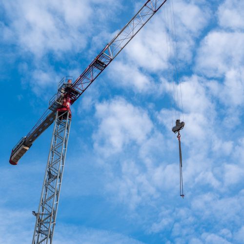Tower crane against the background of the blue sky, Bucharest, Romania